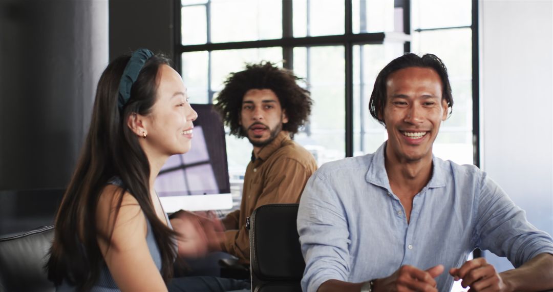 Diverse Team Engaging in Productive Work Discussion at Office