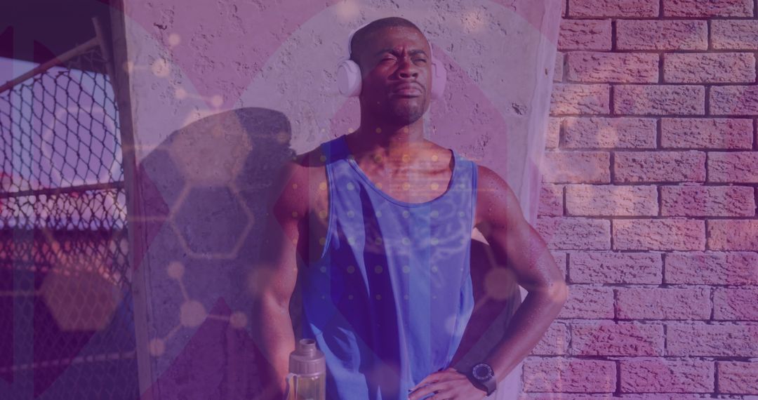 African American Athlete Evaluating Data with Digital Overlay