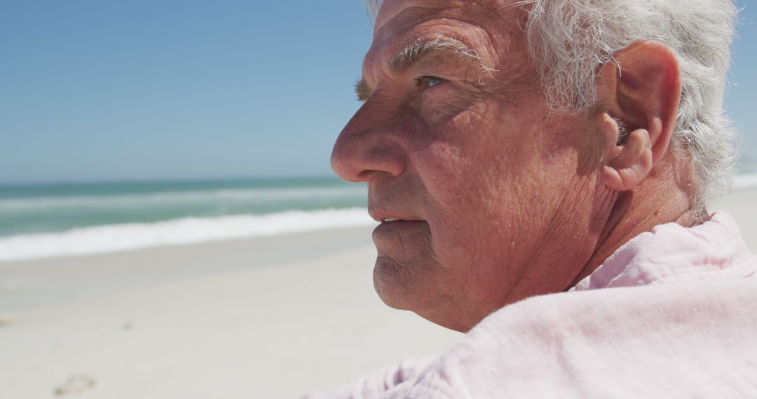 Senior Man Enjoying Peaceful Beach Day - Free Images, Stock Photos and Pictures on Pikwizard.com