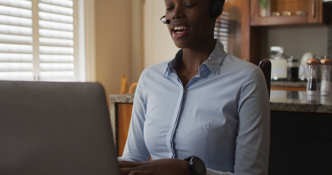 African American Woman Wearing Headset Working from Home Office - Free Images, Stock Photos and Pictures on Pikwizard.com