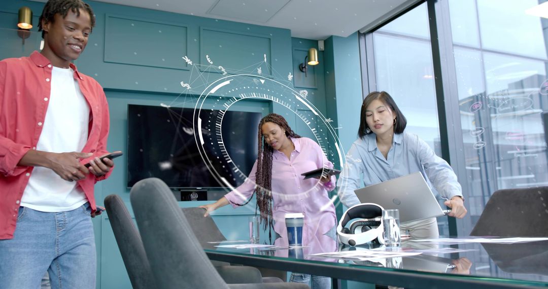 Diverse team collaborating on digital strategy in modern conference room with VR headset and laptops