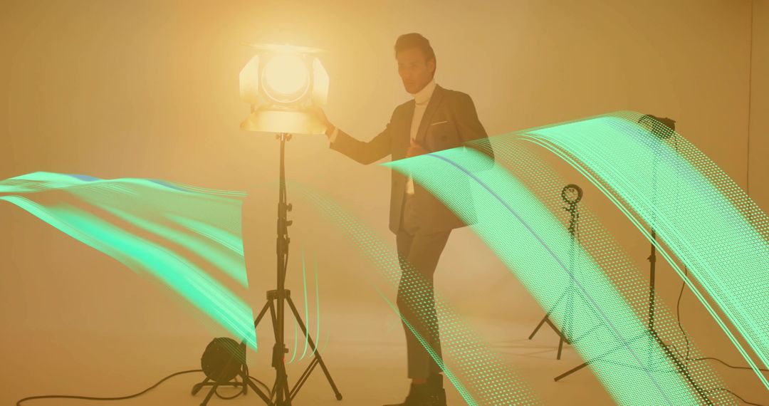Man in Sophisticated Attire with Studio Light and Dynamic Green LED Trails