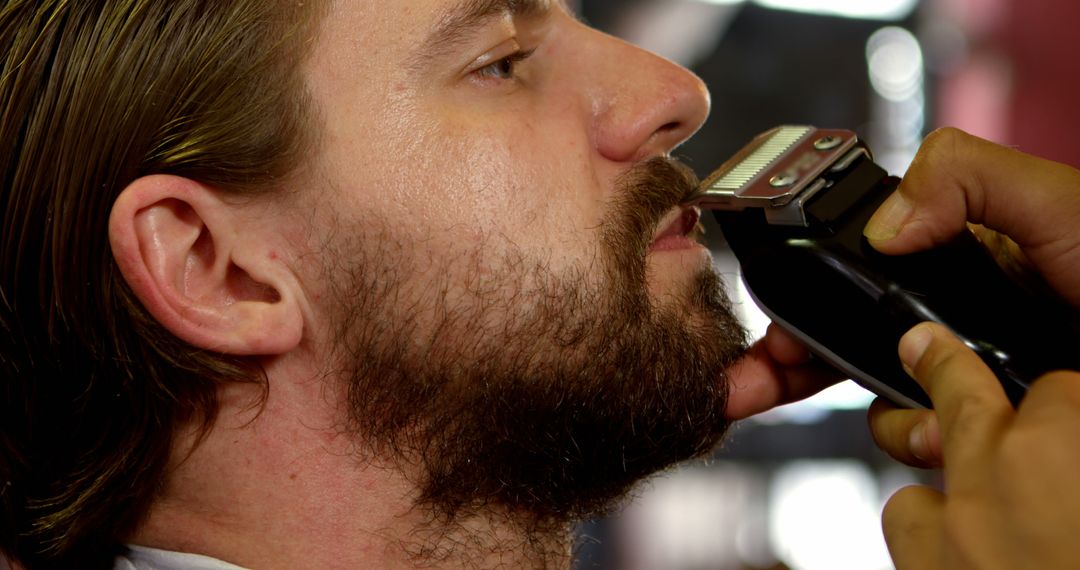 Man Getting Beard Trimmed at Barbershop - Free Images, Stock Photos and Pictures on Pikwizard.com