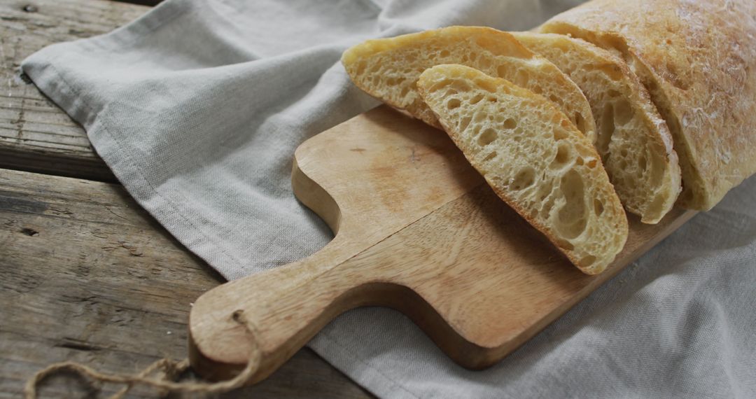 Fresh Artisan Bread on Rustic Wooden Breadboard