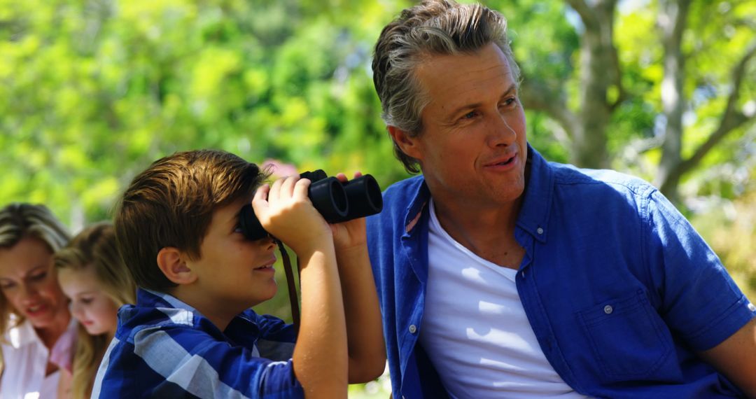 Father and Son Birdwatching in Nature - Free Images, Stock Photos and Pictures on Pikwizard.com