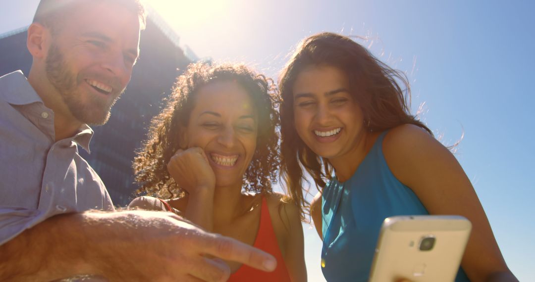 Diverse Friends Enjoying Selfie on Sunny Day Outdoors - Free Images, Stock Photos and Pictures on Pikwizard.com