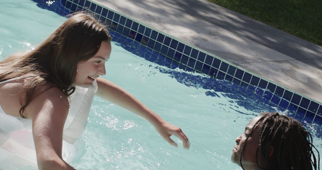 Teens Enjoying Summer Fun in Swimming Pool - Free Images, Stock Photos and Pictures on Pikwizard.com