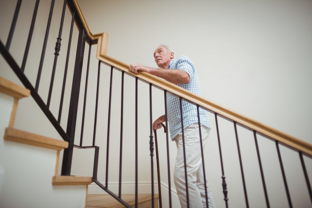 Senior Man Using Walking Stick on Staircase - Free Images, Stock Photos and Pictures on Pikwizard.com