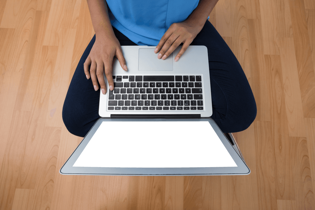 Transparent Laptop Usage Overhead View on Wooden Floor
