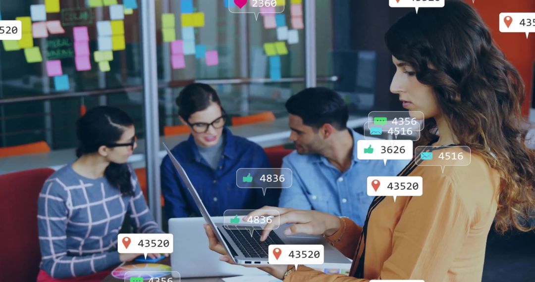 Team Brainstorming with Laptops and Sticky Notes in Modern Office