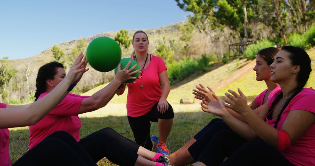 Group of women exercising outdoors with medicine ball - Free Images, Stock Photos and Pictures on Pikwizard.com