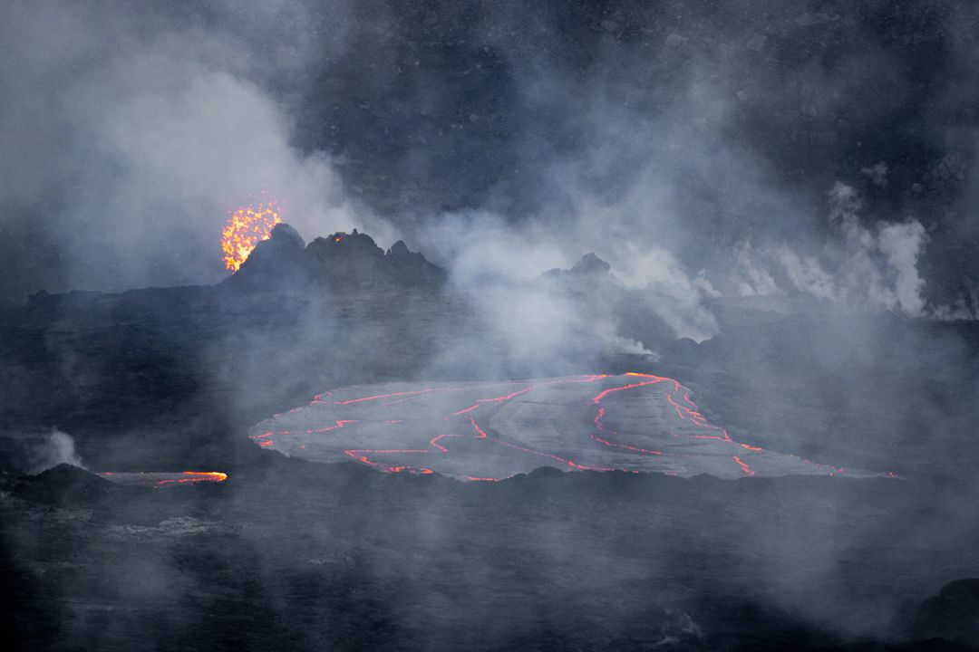 Erupting Volcanic Landscape with Flowing Lava and Smoke