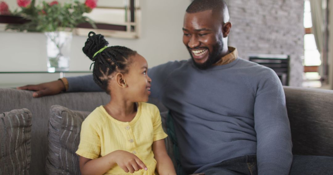 Father and Daughter Enjoying Tablet Time on Couch