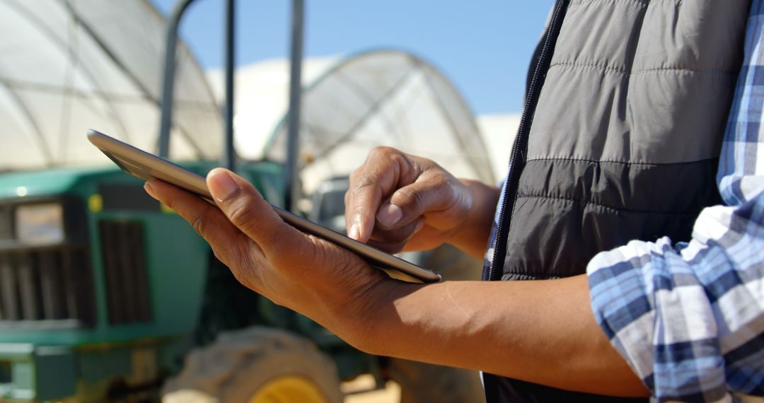 Farmer Using Digital Tablet in Field - Free Images, Stock Photos and Pictures on Pikwizard.com