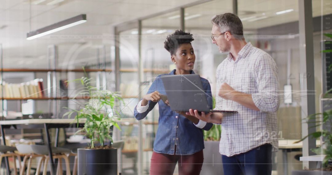 Team Collaboration with Digital Financial Interface in Office Environment