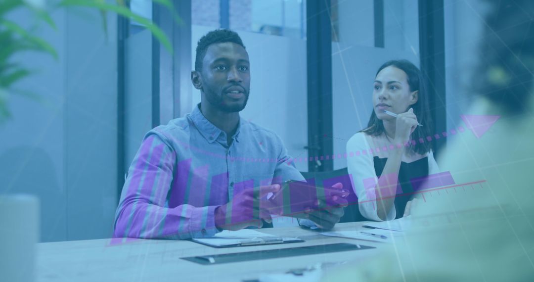 Diverse Professional Team Analyzing Digital Growth Graph in Modern Office