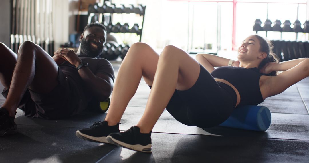 Fitness Enthusiasts Using Foam Rollers Diverse Workout Dynamics