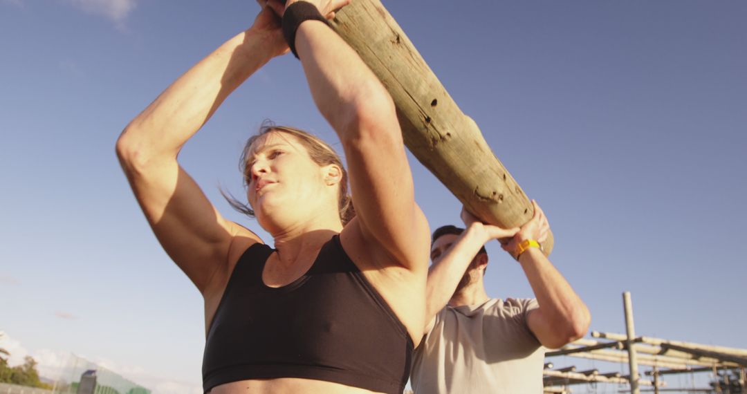 Athletes Training Outdoors with Heavy Wooden Beam - Free Images, Stock Photos and Pictures on Pikwizard.com