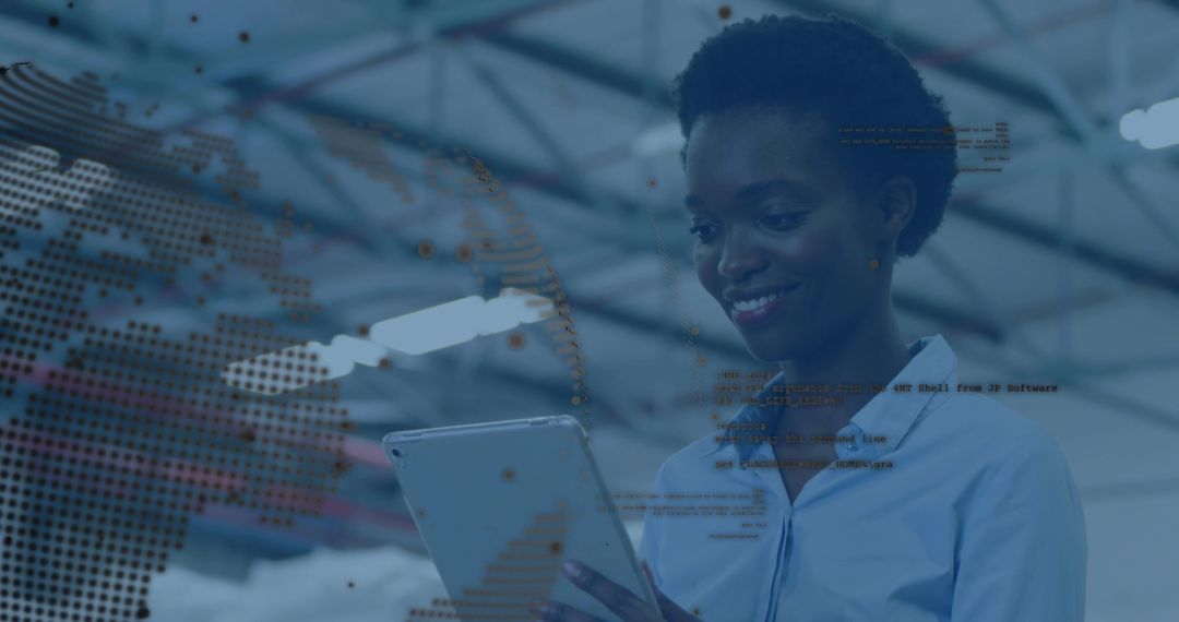 Smiling woman using tablet in industrial warehouse with digital globe and data overlay