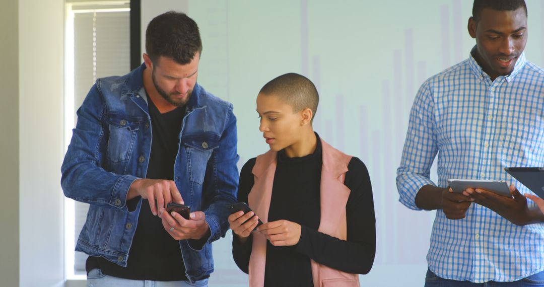 Young Professional Team Collaborating with Mobile Devices