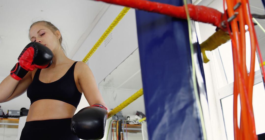 Female Boxer Resting in Ring After Workout - Free Images, Stock Photos and Pictures on Pikwizard.com