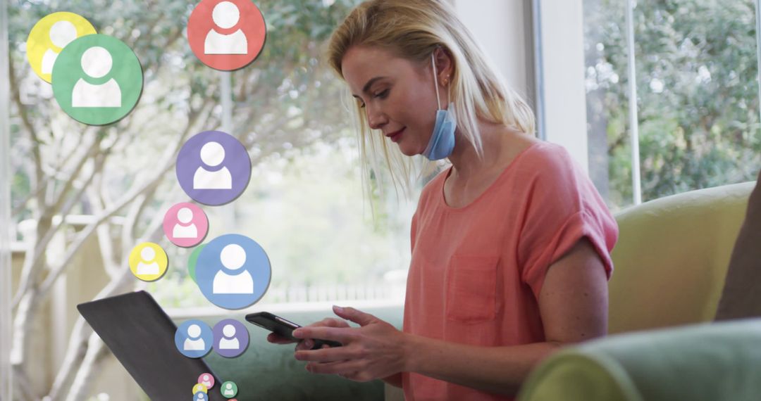 Caucasian Woman Multitasking with Smartphone and Laptop