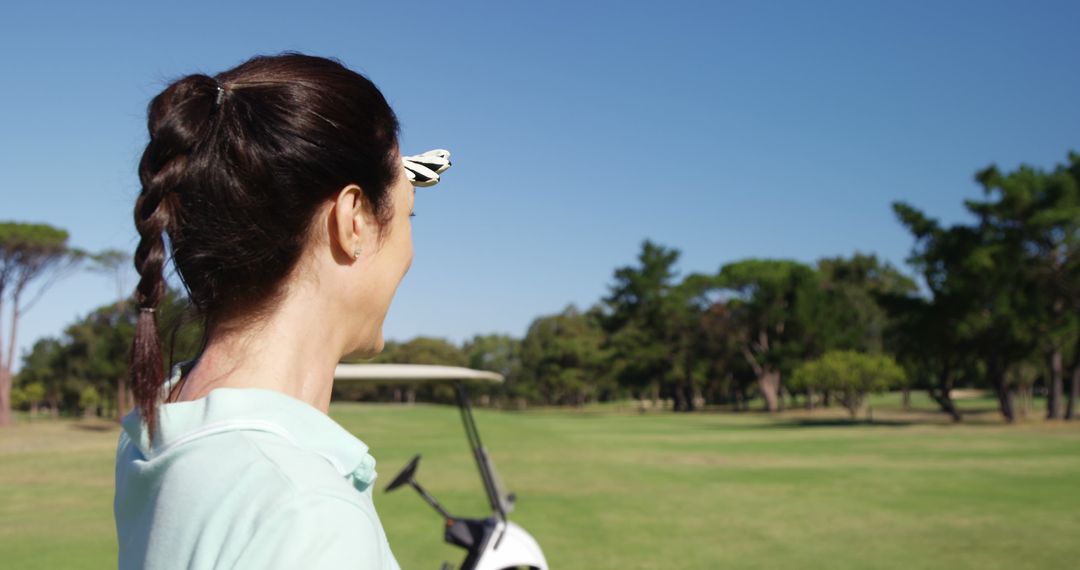 Woman Golfer Viewing Countryside on Golf Course - Free Images, Stock Photos and Pictures on Pikwizard.com