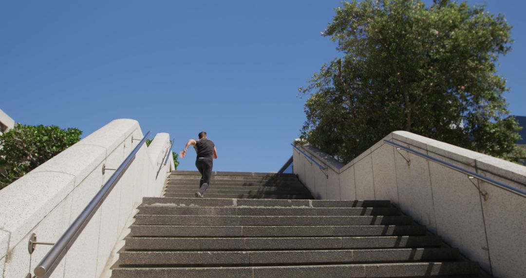 Woman Running Up Outdoor Steps in Urban Area on Sunny Day - Free Images, Stock Photos and Pictures on Pikwizard.com