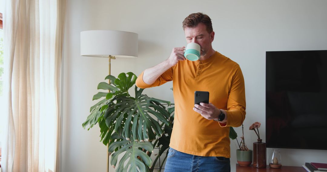 Man Relaxing with Coffee and Smartphone in Modern Living Room