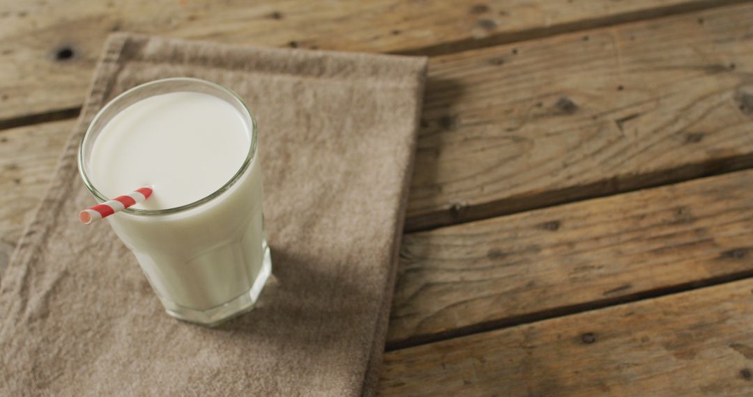 Image of glass of fresh milk on wooden background - Free Images, Stock Photos and Pictures on Pikwizard.com