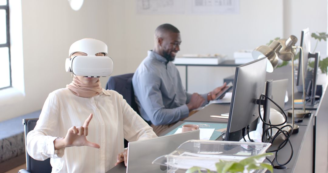 Office Team Using VR and Tablet Technology Stimulating Creativity