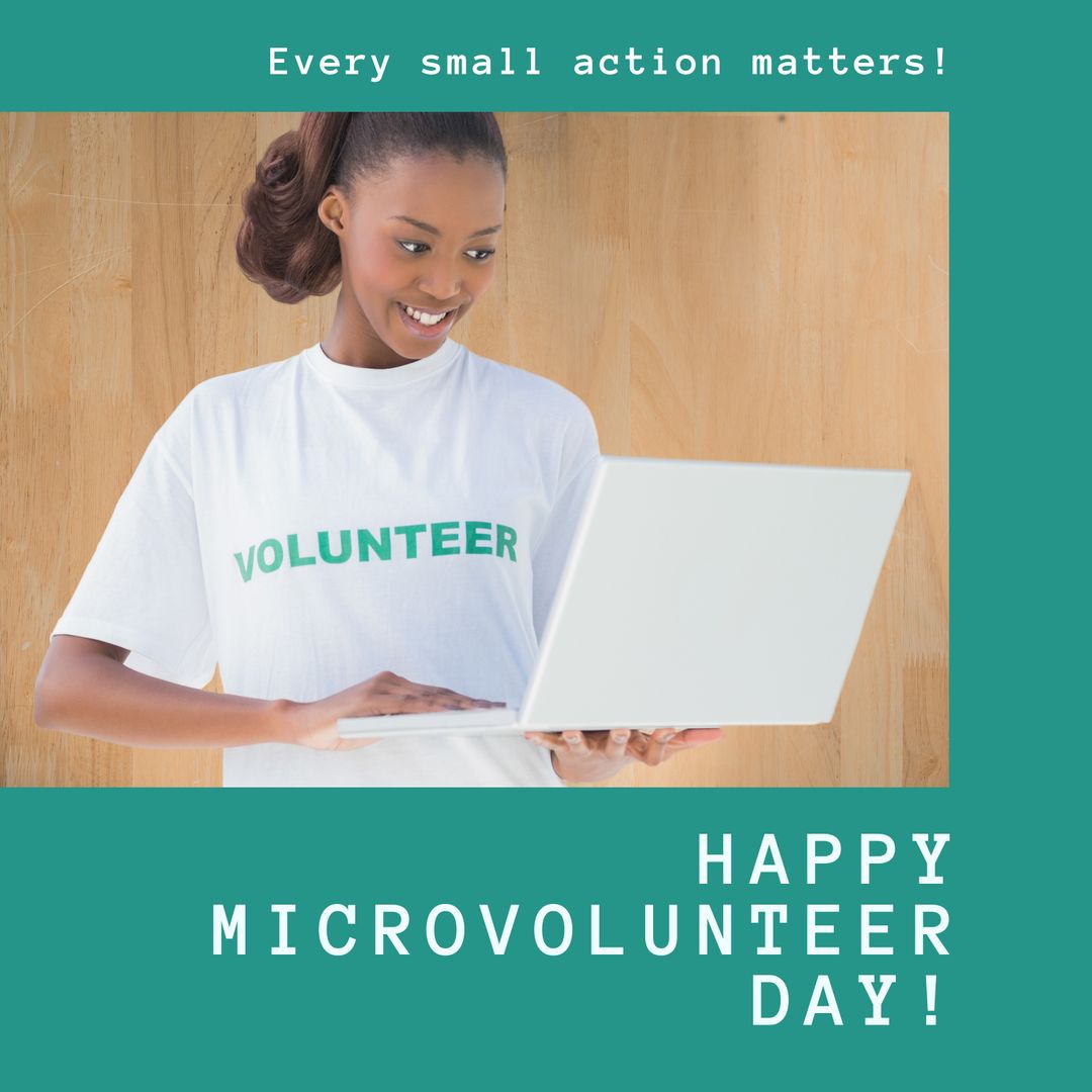 Smiling Volunteer Using Laptop for Microvolunteer Day Awareness