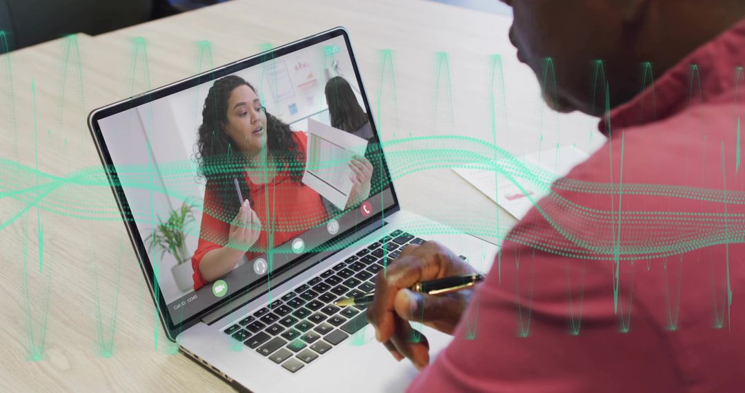 Senior Man Engaged in Virtual Meeting on Laptop with Insights Displayed
