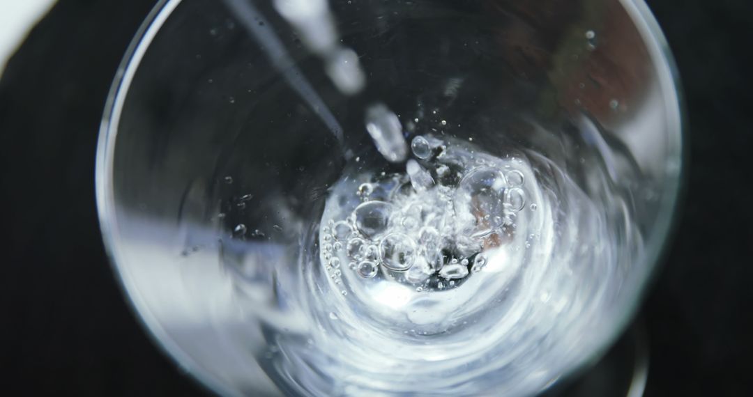 Close-Up of Water Being Poured into Clear Glass - Free Images, Stock Photos and Pictures on Pikwizard.com