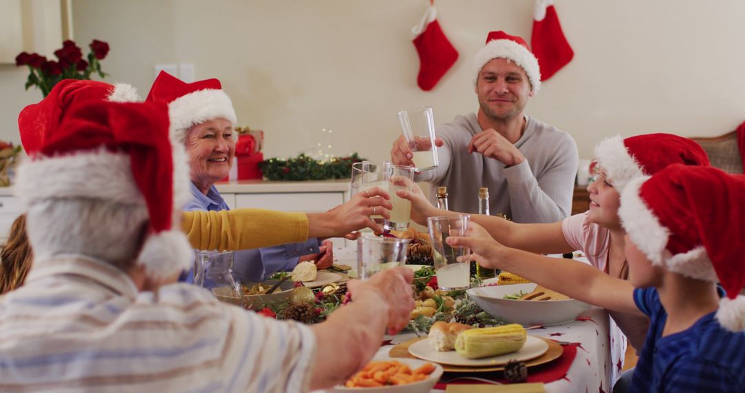 Family Cheerfully Celebrating Christmas Dinner with Santa Hats - Free Images, Stock Photos and Pictures on Pikwizard.com