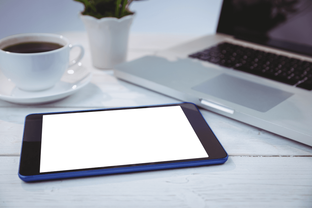 Transparent Tablet and Laptop Workspace with Coffee