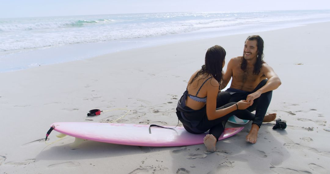 Young Couple Enjoying Beach Moment with Surfboard by the Ocean - Free Images, Stock Photos and Pictures on Pikwizard.com