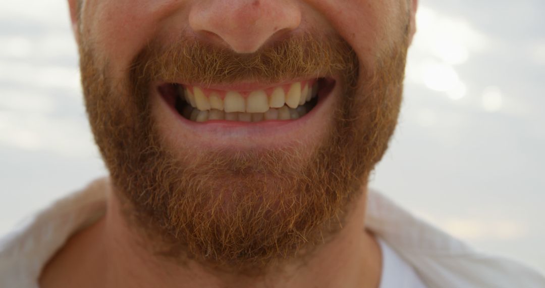 Close-up of Smiling Man with Red Beard in Soft Light Outdoors - Free Images, Stock Photos and Pictures on Pikwizard.com