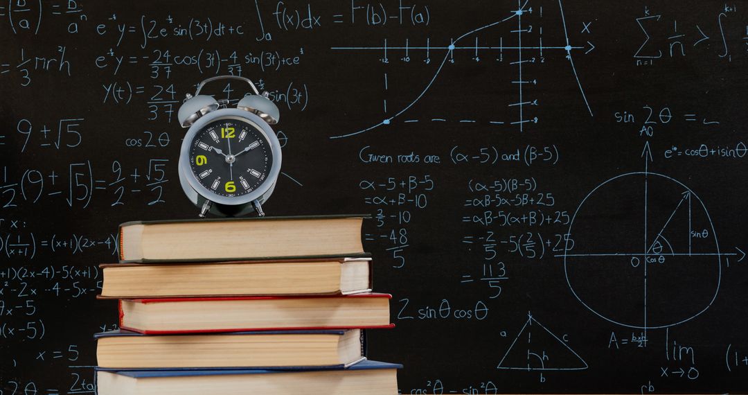 Alarm Clock on Books with Math Equations on Chalkboard