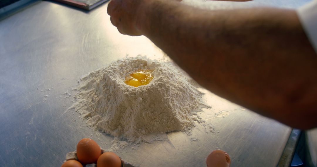 Chef Preparing Fresh Pasta Dough with Flour and Eggs in Kitchen - Free Images, Stock Photos and Pictures on Pikwizard.com