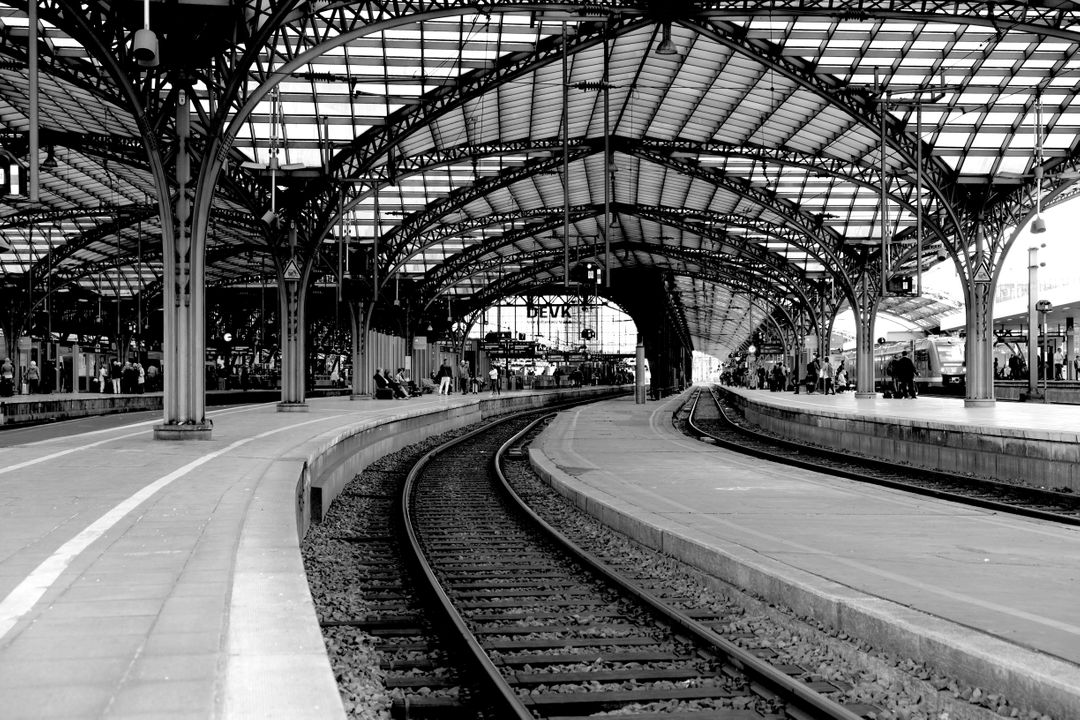 Vintage Train Station with Curved Tracks and Steel Roof - Free Images, Stock Photos and Pictures on Pikwizard.com