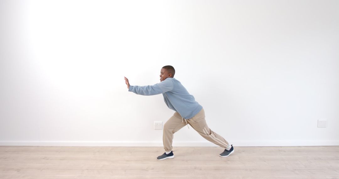 Young Boy Practicing Balance Exercise for Strength and Stability