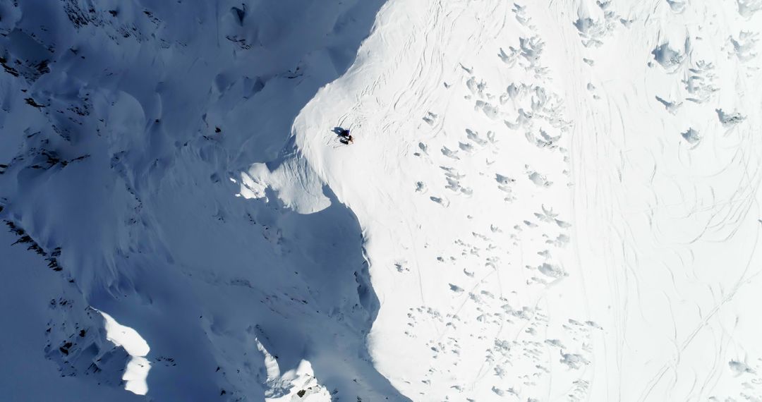 Aerial View of Skiers on Snowy Mountain Slope - Free Images, Stock Photos and Pictures on Pikwizard.com