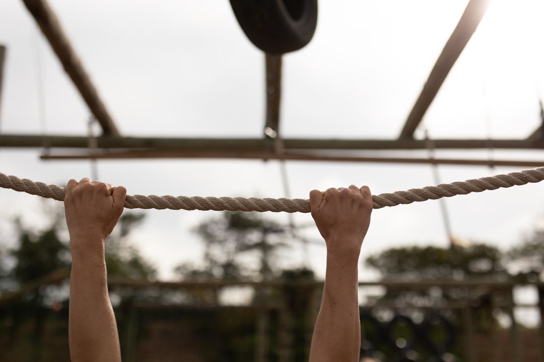 Caucasian Woman Performing Outdoor Rope Exercise in Boot Camp - Free Images, Stock Photos and Pictures on Pikwizard.com