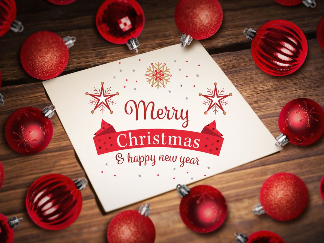 Festive Christmas Card with Red Ornaments on Wooden Background
