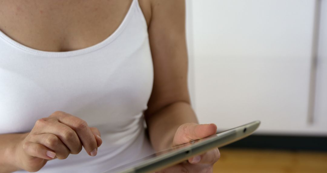 Woman Using Digital Tablet in Casual Home Setting - Free Images, Stock Photos and Pictures on Pikwizard.com