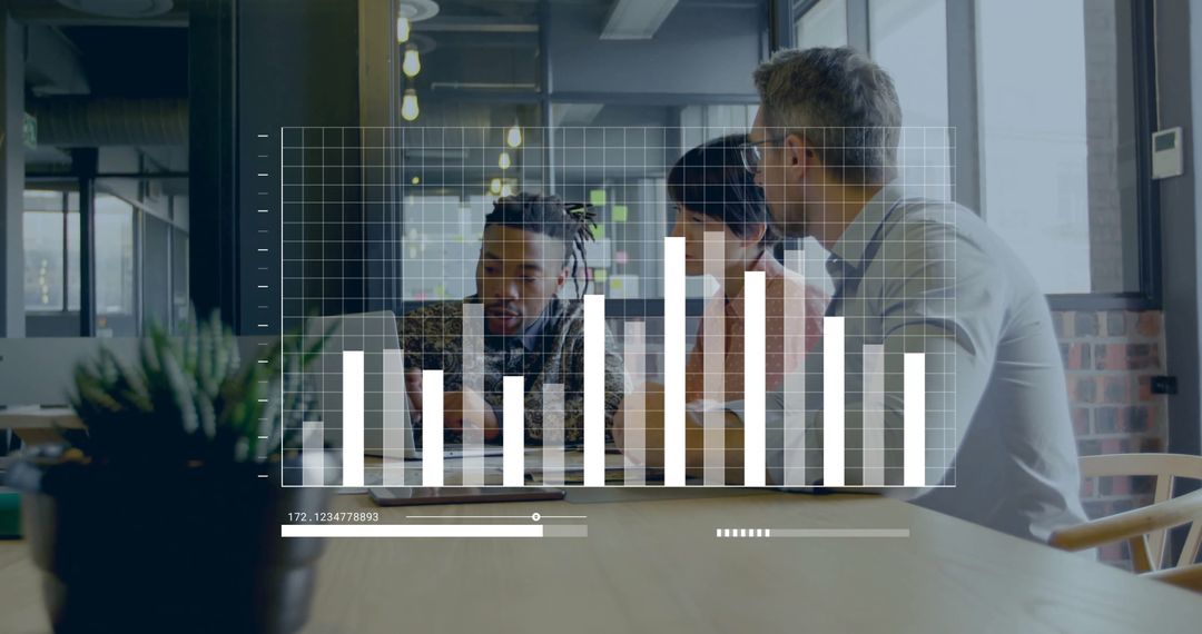 Diverse Team Analyzing Data on Screen in Modern Office Atmosphere