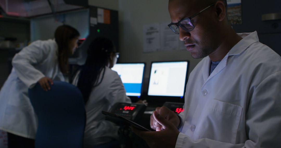 Scientist Analyzing Data on Tablet in Dynamic Research Lab - Free Images, Stock Photos and Pictures on Pikwizard.com