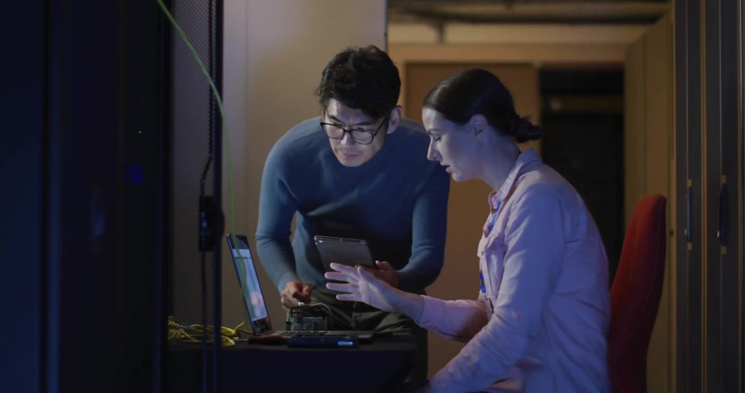 Team Analyzing Data in Server Room for Cybersecurity