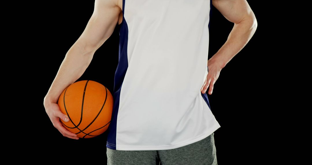 Athlete Holding Basketball in Sports Attire - Free Images, Stock Photos and Pictures on Pikwizard.com